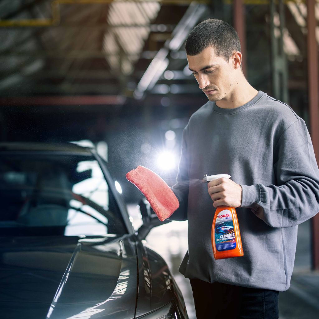 Man spraying SONAX Ceramic Series